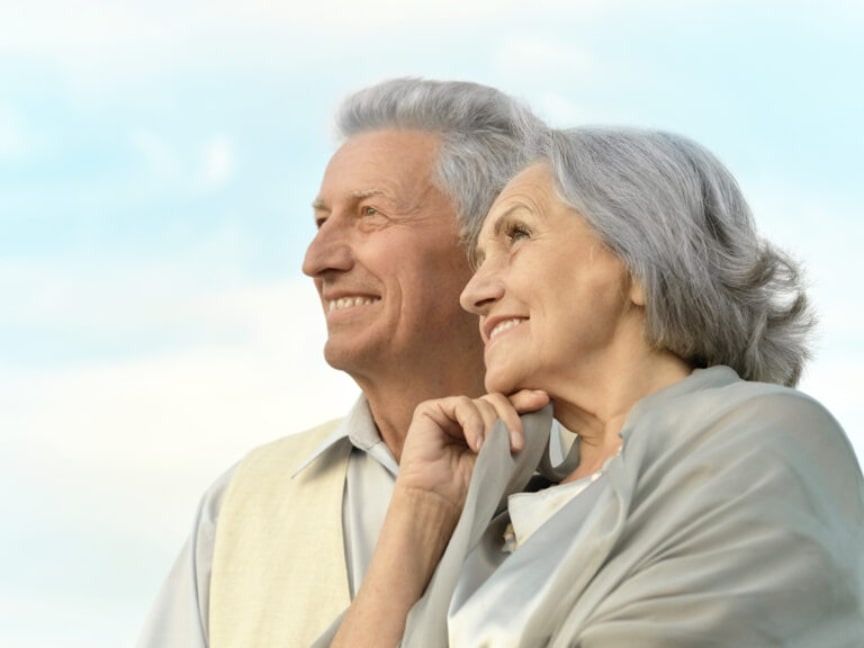 elderly couple smiling with confidence due to reliable incontinence care using high-absorbency adult diapers