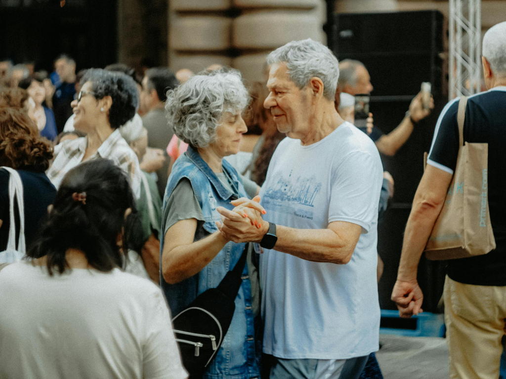 Happy Senior Couple Enjoying An Outdoor Music Festival — senior care guide